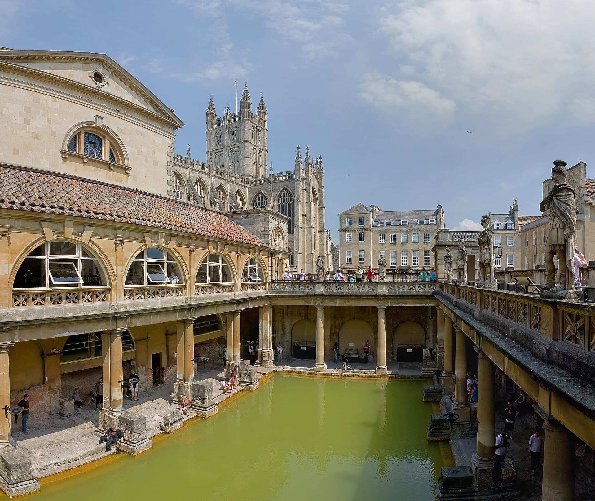 The Great Bath at the Roman Baths, with Bath Abbey rising behind it