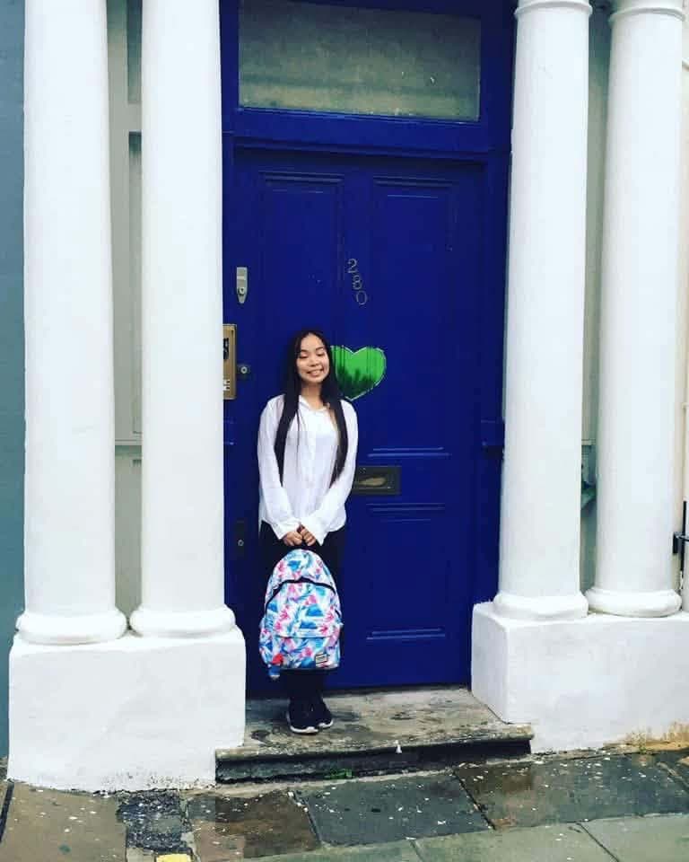 The BeExplorers guide at the blue door in Notting Hill made famous by the film