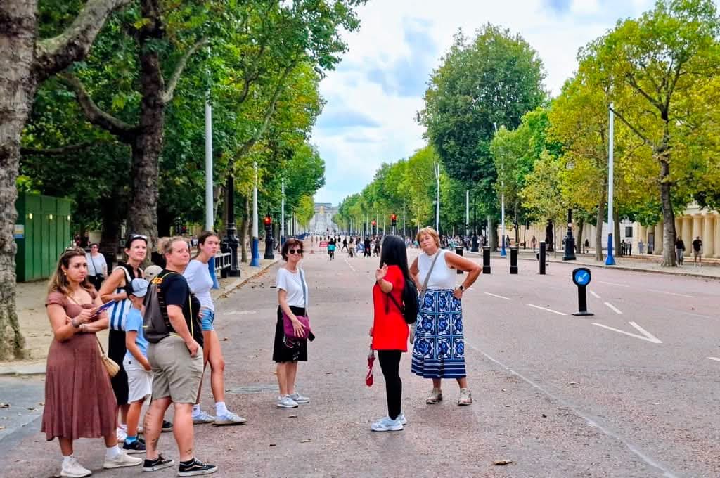 A BeExplorers walking group listening to their guide on The Mall