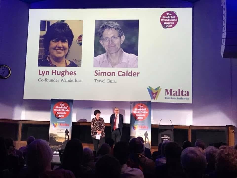 Lyn Hughes and Simon Calder on stage at the Wanderlust World Guide Awards 2019